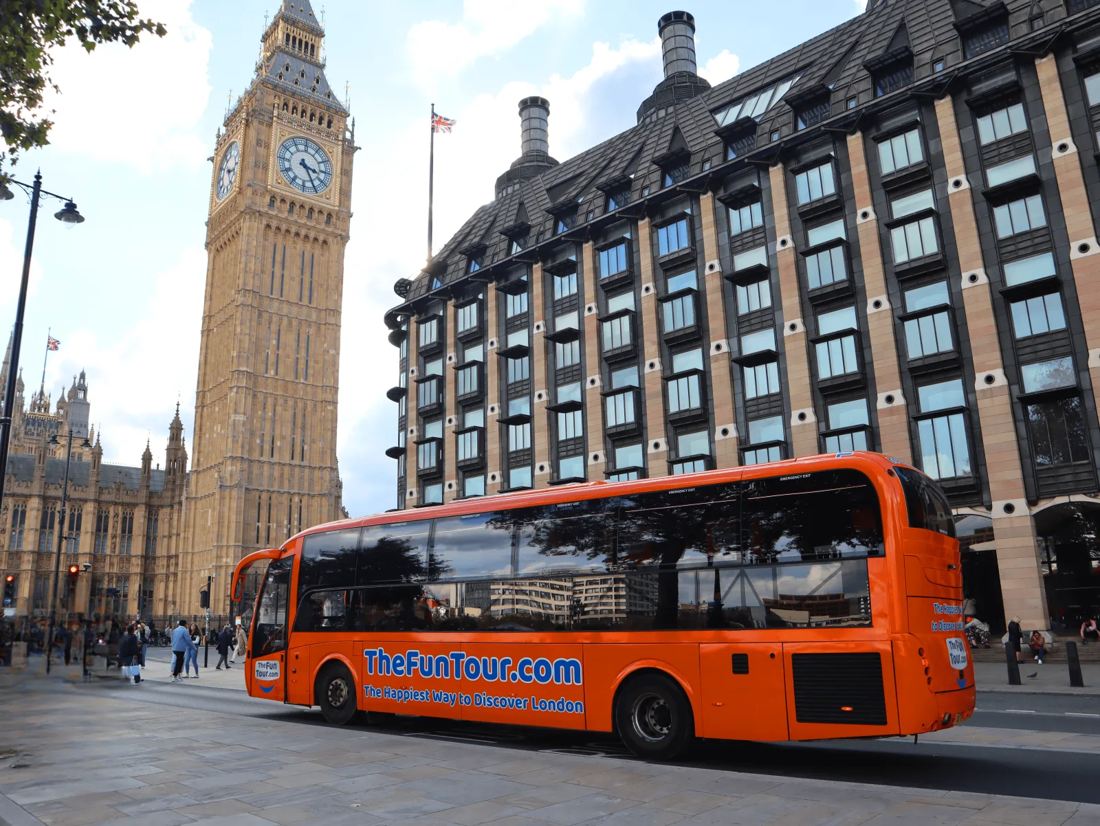 The orange Fun Tour bus parked in front of Big Ben